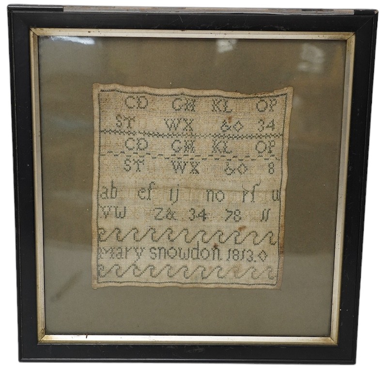 An early 19th century alphabet sampler worked by Mary Snowdon 1813, 21 x 19cm. Condition - poor